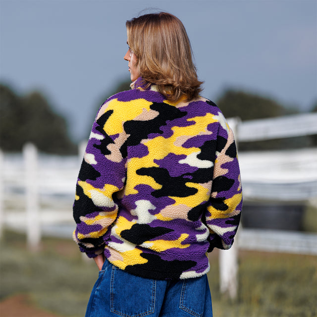 Model wearing the Sherpa 1/4 Zip Pullover in purple and gold camo, back view