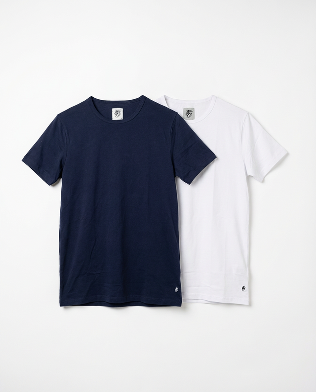 Navy and white t-shirts on a light gray background