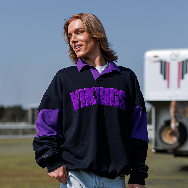 Model wearing the Rugby Shirt in black and purple, front view
