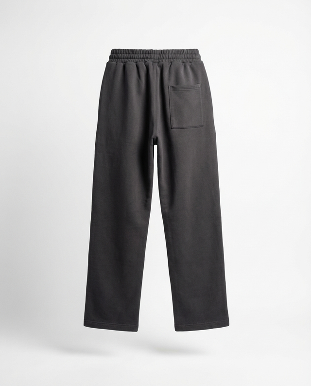 The back of black pants on a white background